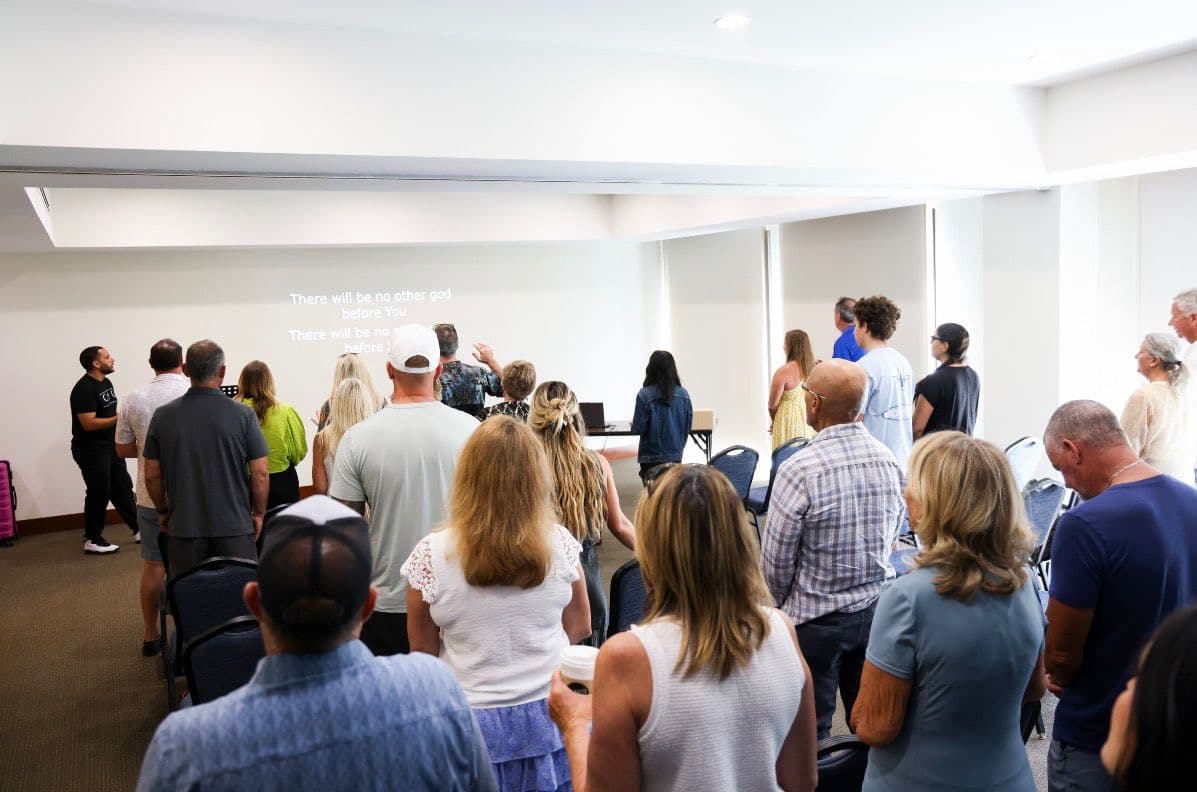 Church in the Community congregation in worship